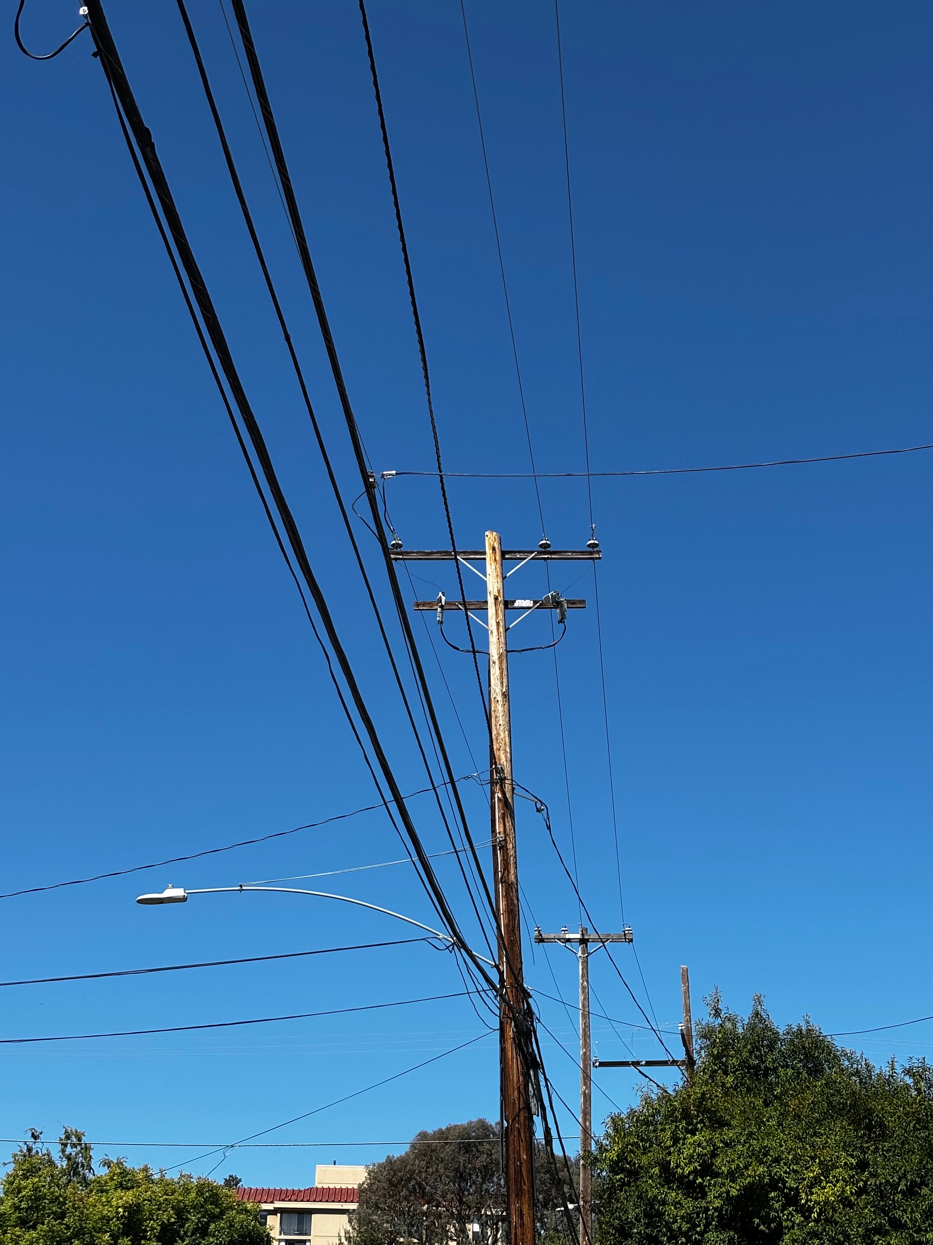 Distribution tower and cables extending to houses